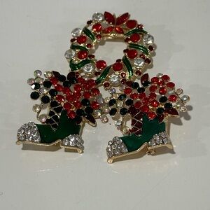 Three piece, gold tone, Christmas, red, black, green and white enamel brooch.